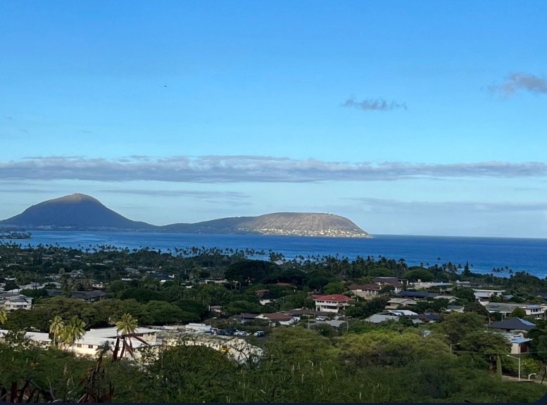View over a coastal town toward offshore islets